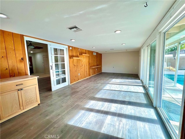42915 Wisconsin Ave, Palm Desert, CA 92211 - unfurnished living room featuring wood finished floors, wooden walls, french doors, and recessed lighting