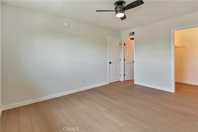 1640 235th St Unit D, Harbor City, CA 90710 - unfurnished bedroom featuring light wood-style flooring, a walk in closet, ceiling fan, and a closet
