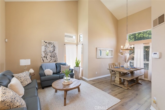 13100 Red Corral Dr, Corona, CA 92883 - living area featuring high vaulted ceiling, a chandelier, and wood finished floors
