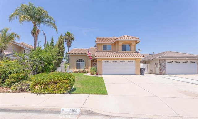 13100 Red Corral Dr, Corona, CA 92883 - mediterranean / spanish-style house featuring stucco siding, a tiled roof, driveway, and an attached garage