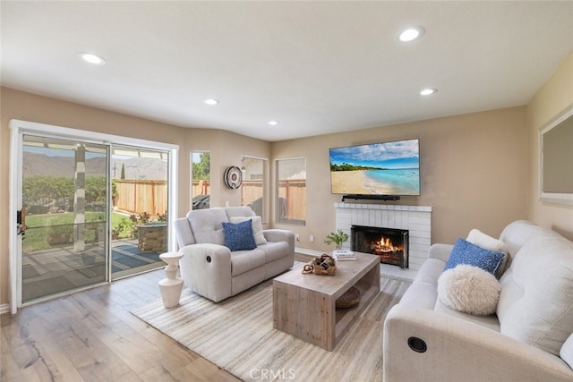 13100 Red Corral Dr, Corona, CA 92883 - living area featuring light wood-style flooring, recessed lighting, and a brick fireplace