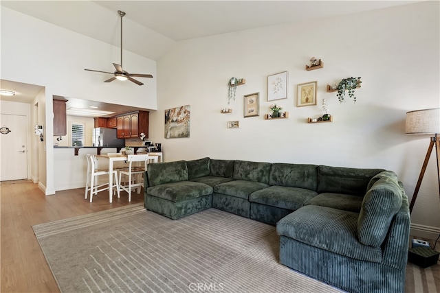 1103 Stone Pine Ln Unit C, Corona, CA 92879 - living area with a ceiling fan, wood finished floors, and vaulted ceiling