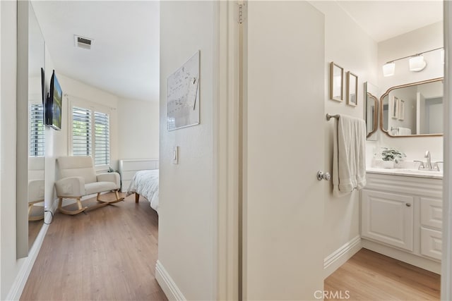 1103 Stone Pine Ln Unit C, Corona, CA 92879 - bathroom with vanity and wood finished floors