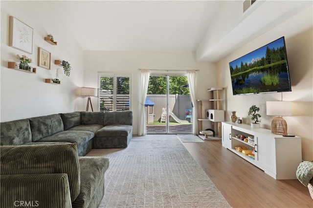1103 Stone Pine Ln Unit C, Corona, CA 92879 - living area featuring wood finished floors and vaulted ceiling