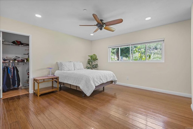 9915 Jacoby Rd, Spring Valley, CA 91977 - bedroom featuring a spacious closet, a closet, hardwood / wood-style floors, a ceiling fan, and recessed lighting