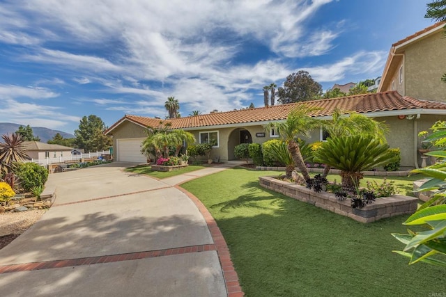 9915 Jacoby Rd, Spring Valley, CA 91977 - view of front of house with a tiled roof, stucco siding, driveway, a front lawn, and a garage