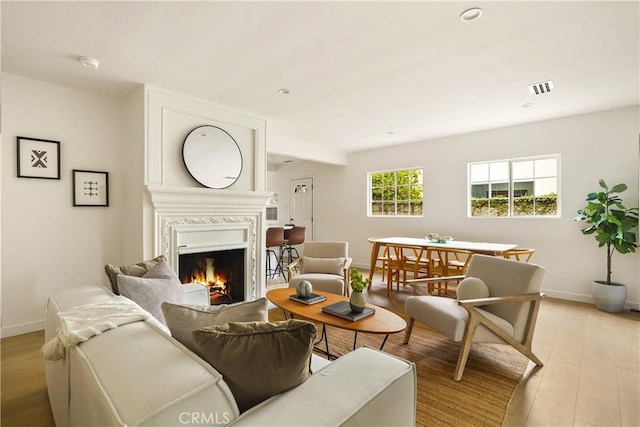 14519 Addison, Sherman Oaks, CA 91403 - living area with light wood-style flooring, a large fireplace, and recessed lighting