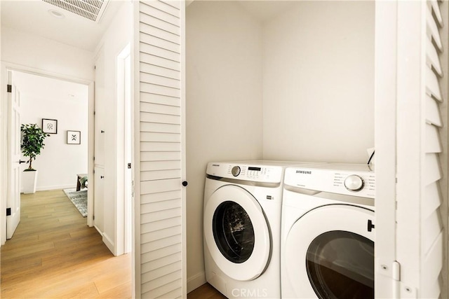 14519 Addison, Sherman Oaks, CA 91403 - laundry area with washing machine and dryer and light wood-style floors