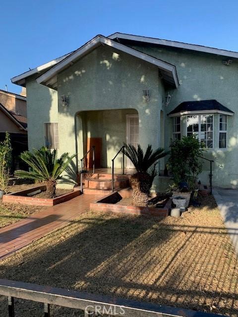 6818 Cedar St, Huntington Park, CA 90255 - view of front facade featuring stucco siding