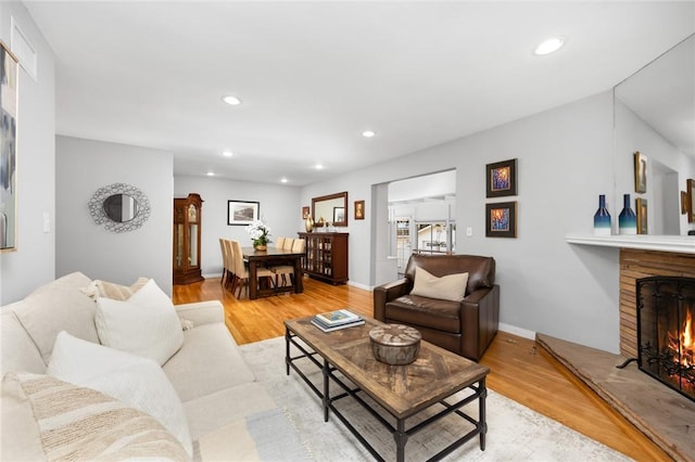 365 N Ivy Ave, Monrovia, CA 91016 - living room with light wood-style floors, a lit fireplace, and recessed lighting