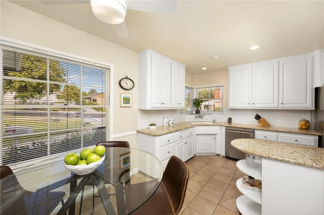 365 N Ivy Ave, Monrovia, CA 91016 - kitchen with stainless steel dishwasher, white cabinetry, backsplash, and recessed lighting