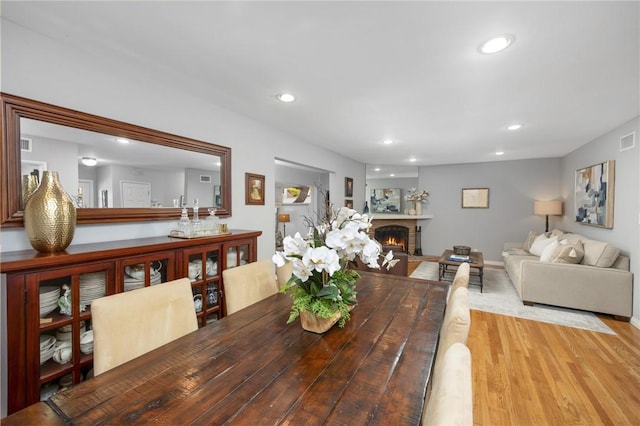 365 N Ivy Ave, Monrovia, CA 91016 - dining area featuring wood finished floors, a lit fireplace, and recessed lighting