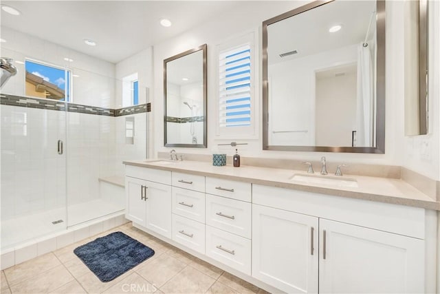 97 Eclipse, Lake Forest, CA 92630 - full bath with double vanity, tile patterned floors, and a shower stall
