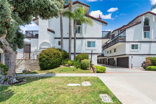 410 N Broadway Unit C, Redondo Beach, CA 90277 - view of building exterior with an attached garage, driveway, and stairway