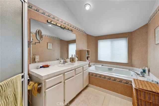 410 N Broadway Unit C, Redondo Beach, CA 90277 - bathroom featuring vanity, a garden tub, vaulted ceiling, and tile patterned flooring