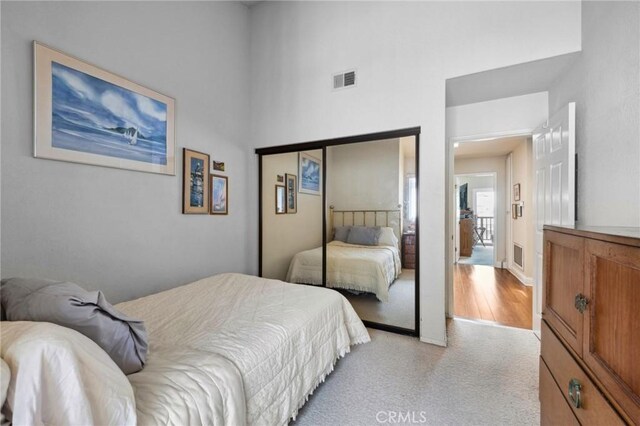 410 N Broadway Unit C, Redondo Beach, CA 90277 - bedroom with light carpet, a closet, and a towering ceiling