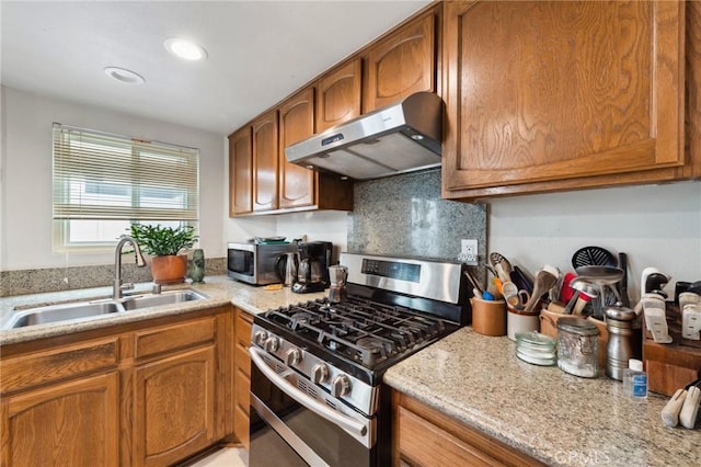 410 N Broadway Unit C, Redondo Beach, CA 90277 - kitchen with appliances with stainless steel finishes, range hood, brown cabinets, and recessed lighting