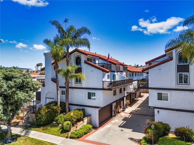 410 N Broadway Unit C, Redondo Beach, CA 90277 - view of building exterior with an attached garage and driveway