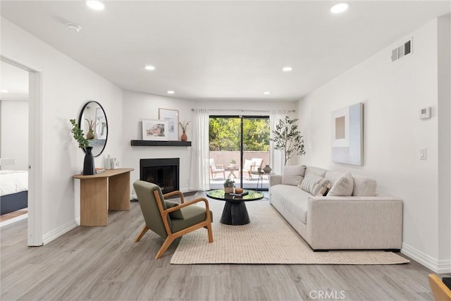4210 Via Arbolada Unit 105, Los Angeles, CA 90042 - living area featuring recessed lighting, wood finished floors, and a fireplace