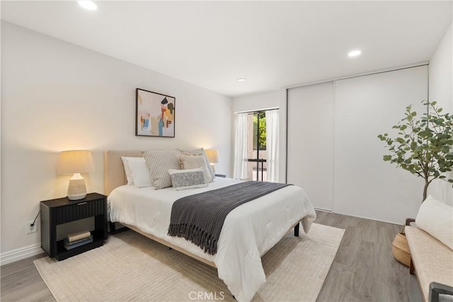 4210 Via Arbolada Unit 105, Los Angeles, CA 90042 - bedroom featuring light wood-style floors, a closet, and recessed lighting