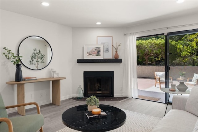 4210 Via Arbolada Unit 105, Los Angeles, CA 90042 - living area featuring recessed lighting, wood finished floors, and a tiled fireplace