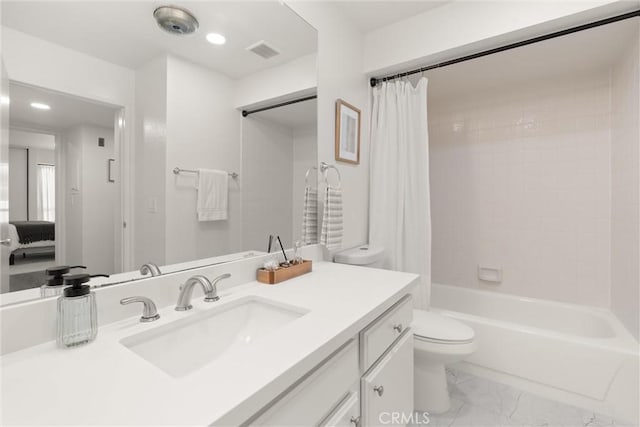 4210 Via Arbolada Unit 105, Los Angeles, CA 90042 - bathroom featuring vanity, shower / bath combo, marble finish flooring, and recessed lighting