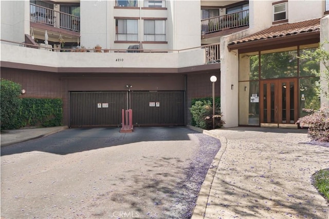 4210 Via Arbolada Unit 105, Los Angeles, CA 90042 - view of front of house featuring french doors and stucco siding