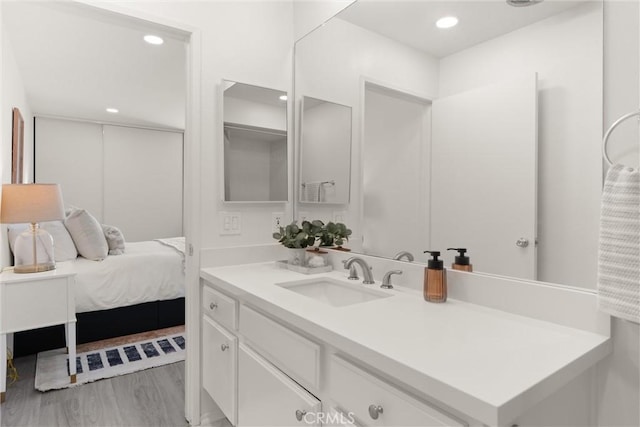 4210 Via Arbolada Unit 105, Los Angeles, CA 90042 - bathroom with vanity, recessed lighting, and wood finished floors