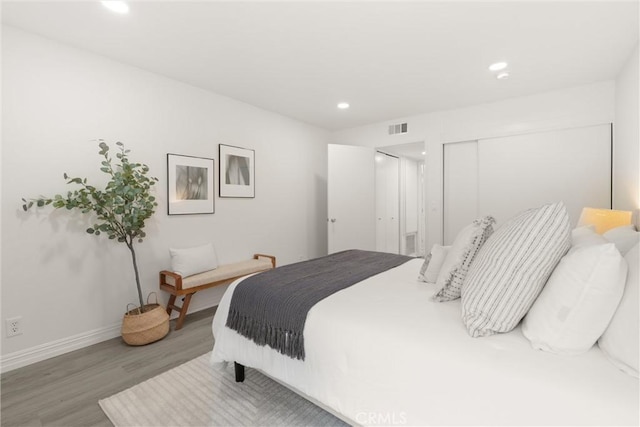 4210 Via Arbolada Unit 105, Los Angeles, CA 90042 - bedroom with wood finished floors, recessed lighting, and a closet
