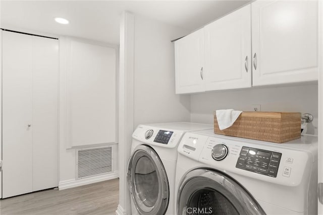4210 Via Arbolada Unit 105, Los Angeles, CA 90042 - laundry room with cabinet space, separate washer and dryer, light wood-style flooring, and recessed lighting