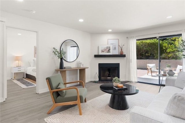 4210 Via Arbolada Unit 105, Los Angeles, CA 90042 - living room featuring wood finished floors, recessed lighting, and a fireplace with raised hearth