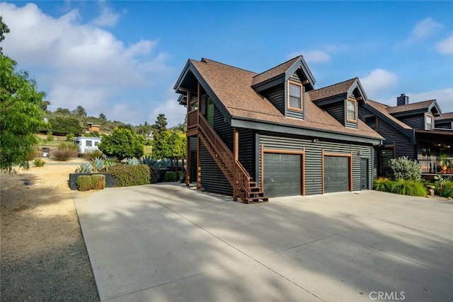 1186 Ramblin Rose Way, Arroyo Grande, CA 93420 - view of property exterior featuring driveway, stairway, and roof with shingles