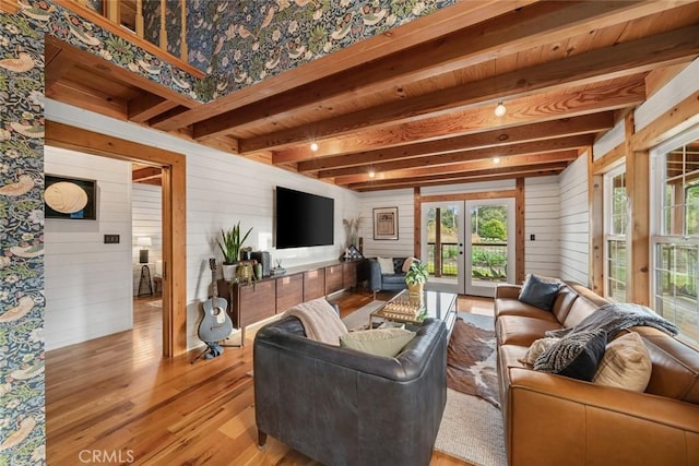 1186 Ramblin Rose Way, Arroyo Grande, CA 93420 - living area with beamed ceiling, french doors, healthy amount of natural light, wooden walls, and light wood finished floors