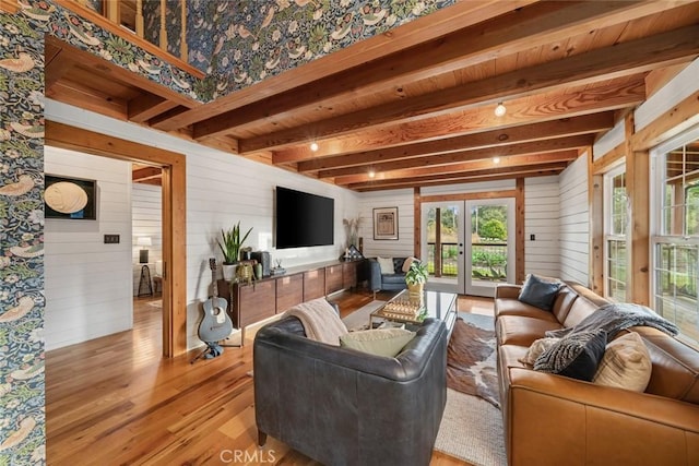 1186 Ramblin Rose Way, Arroyo Grande, CA 93420 - living room with beam ceiling, french doors, plenty of natural light, wooden walls, and light wood finished floors