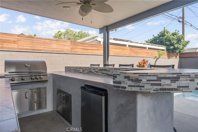 1954 Shipway Ave, Long Beach, CA 90815 - fenced backyard featuring an outdoor kitchen and ceiling fan
