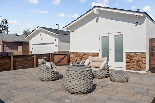 1954 Shipway Ave, Long Beach, CA 90815 - view of patio with a fire pit, french doors, and a garage