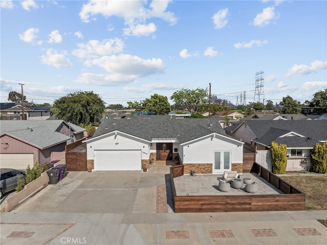 1954 Shipway Ave, Long Beach, CA 90815 - single story home with french doors, stone siding, concrete driveway, a residential view, and an outdoor living space