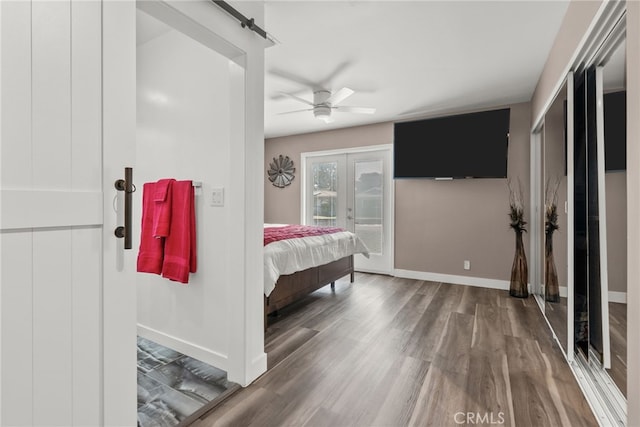 1954 Shipway Ave, Long Beach, CA 90815 - bedroom with wood finished floors, access to outside, french doors, a barn door, and a ceiling fan