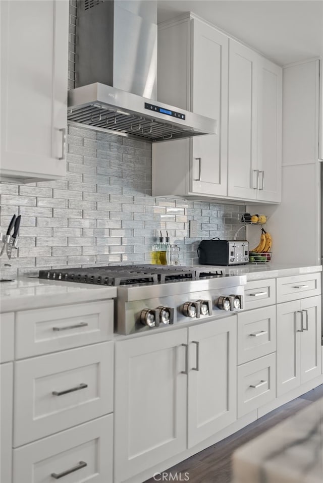 1954 Shipway Ave, Long Beach, CA 90815 - kitchen with wall chimney exhaust hood, stainless steel gas cooktop, white cabinetry, decorative backsplash, and light countertops