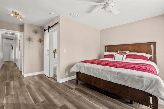 1954 Shipway Ave, Long Beach, CA 90815 - bedroom with wood finished floors, a ceiling fan, ensuite bath, and a barn door