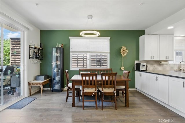 11445 Moorpark St Unit 12, Studio City, CA 91602 - dining room featuring healthy amount of natural light and wood finished floors