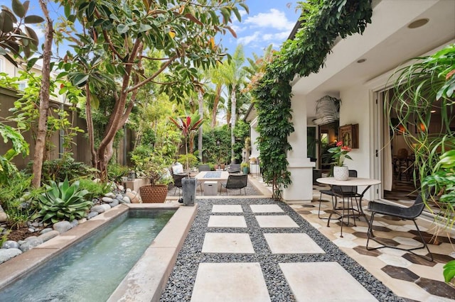 196 Coral Cove Way, Encinitas, CA 92024 - view of patio featuring an outdoor fire pit and an outdoor pool