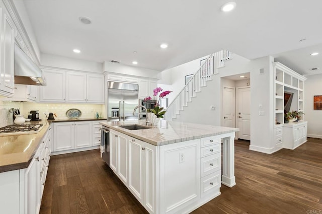 196 Coral Cove Way, Encinitas, CA 92024 - kitchen featuring stainless steel appliances, dark wood finished floors, backsplash, white cabinets, and recessed lighting