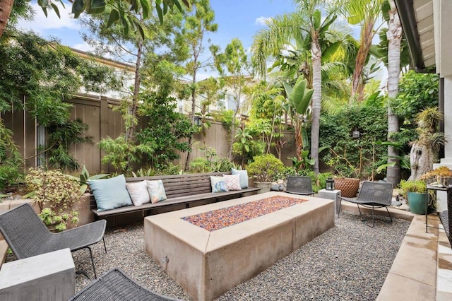196 Coral Cove Way, Encinitas, CA 92024 - fenced backyard featuring a patio and an outdoor living space with a fire pit