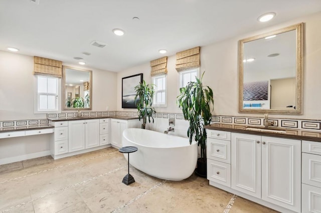 196 Coral Cove Way, Encinitas, CA 92024 - bathroom featuring vanity, a freestanding bath, and recessed lighting