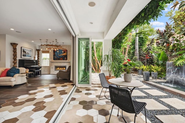 196 Coral Cove Way, Encinitas, CA 92024 - view of patio / terrace with a warm lit fireplace and outdoor dining space