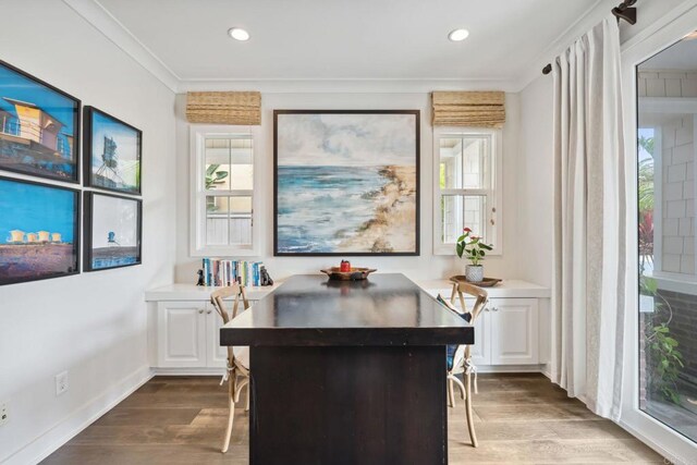 196 Coral Cove Way, Encinitas, CA 92024 - dining area with healthy amount of natural light, dark wood finished floors, recessed lighting, and ornamental molding