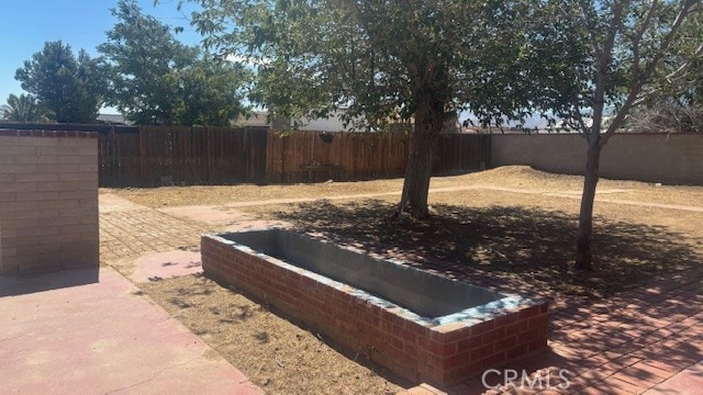 38520 12th St E, Palmdale, CA 93550 - view of storm shelter with a fenced backyard and a patio