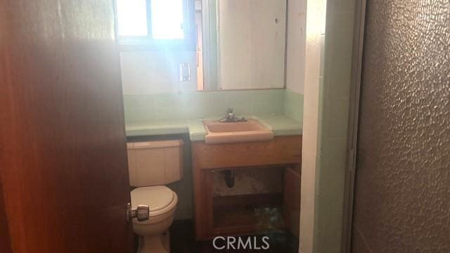 38520 12th St E, Palmdale, CA 93550 - bathroom featuring toilet and vanity