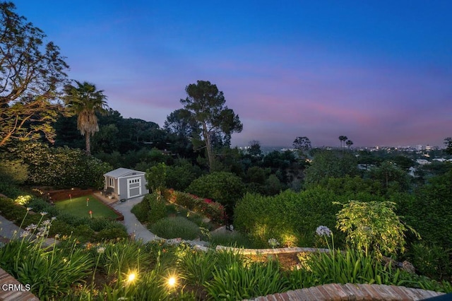 320 N San Rafael Ave, Pasadena, CA 91105 - yard at dusk with a putting green and a storage shed